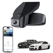 Car rearview mirror built-in dash cam with smartphone app control, 4K Ultra HD recording, GPS tracking, and BMW 5 Series Gen6 models in the background.