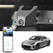 Mangoal rearview mirror built-in dash cam with smartphone app control, 4K Ultra HD recording, GPS tracking, and Subaru BRZ models in the background.